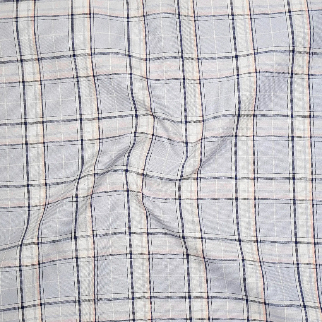 Plaid shirt with a close-up of the fabric on a white background